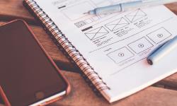 Un cahier avec des wireframes